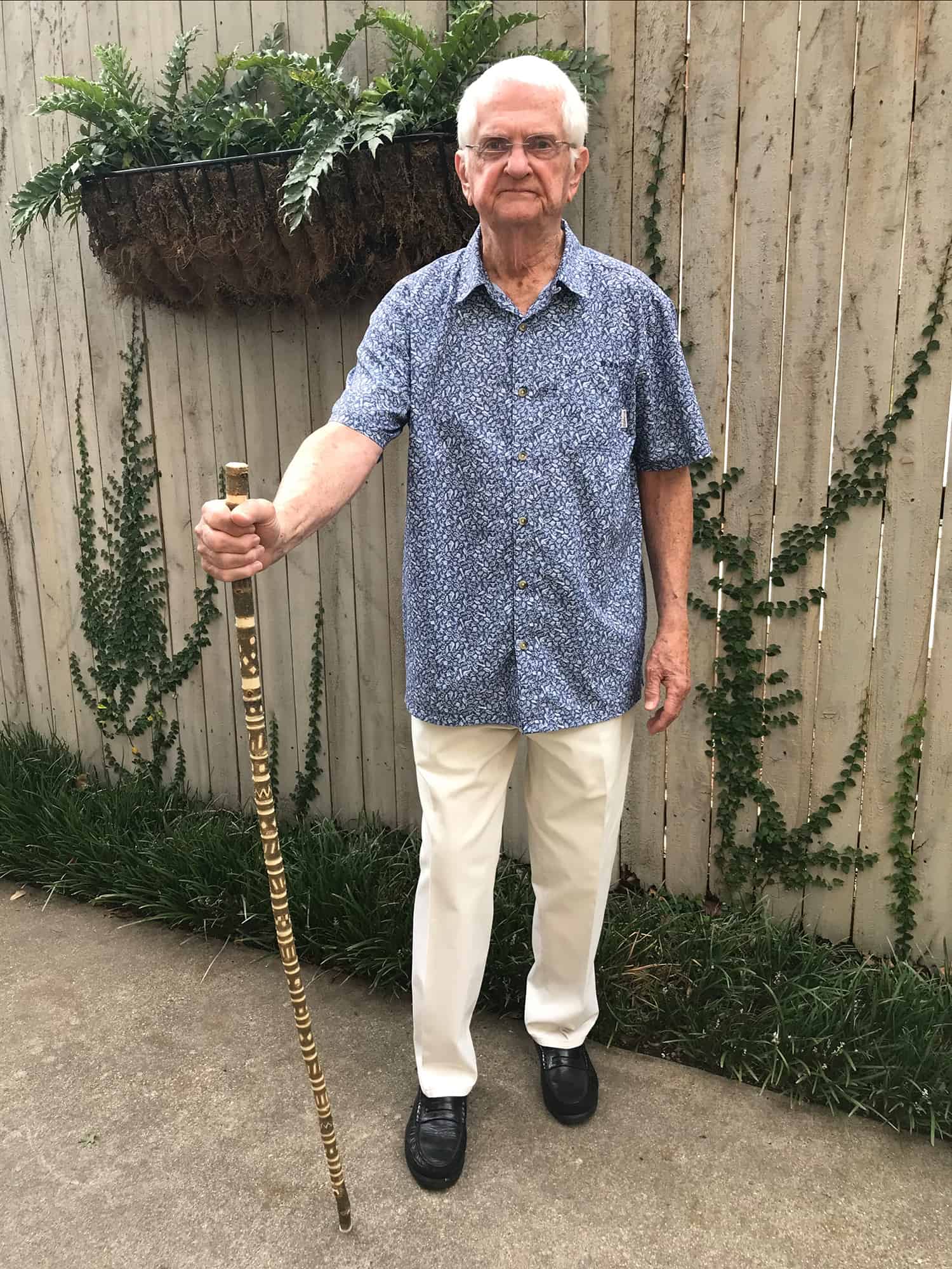 Bill dotson standing outside with his cane