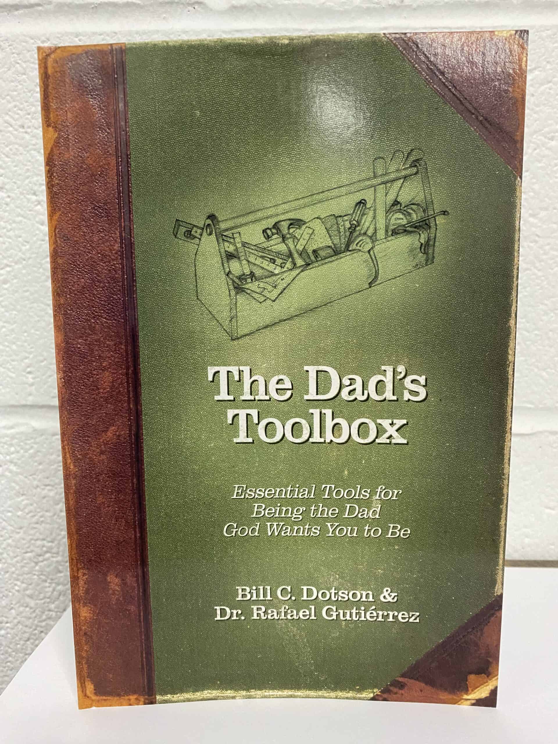 image of The Dad's Toolbox book. It has a toolbox on the cover with a green background.