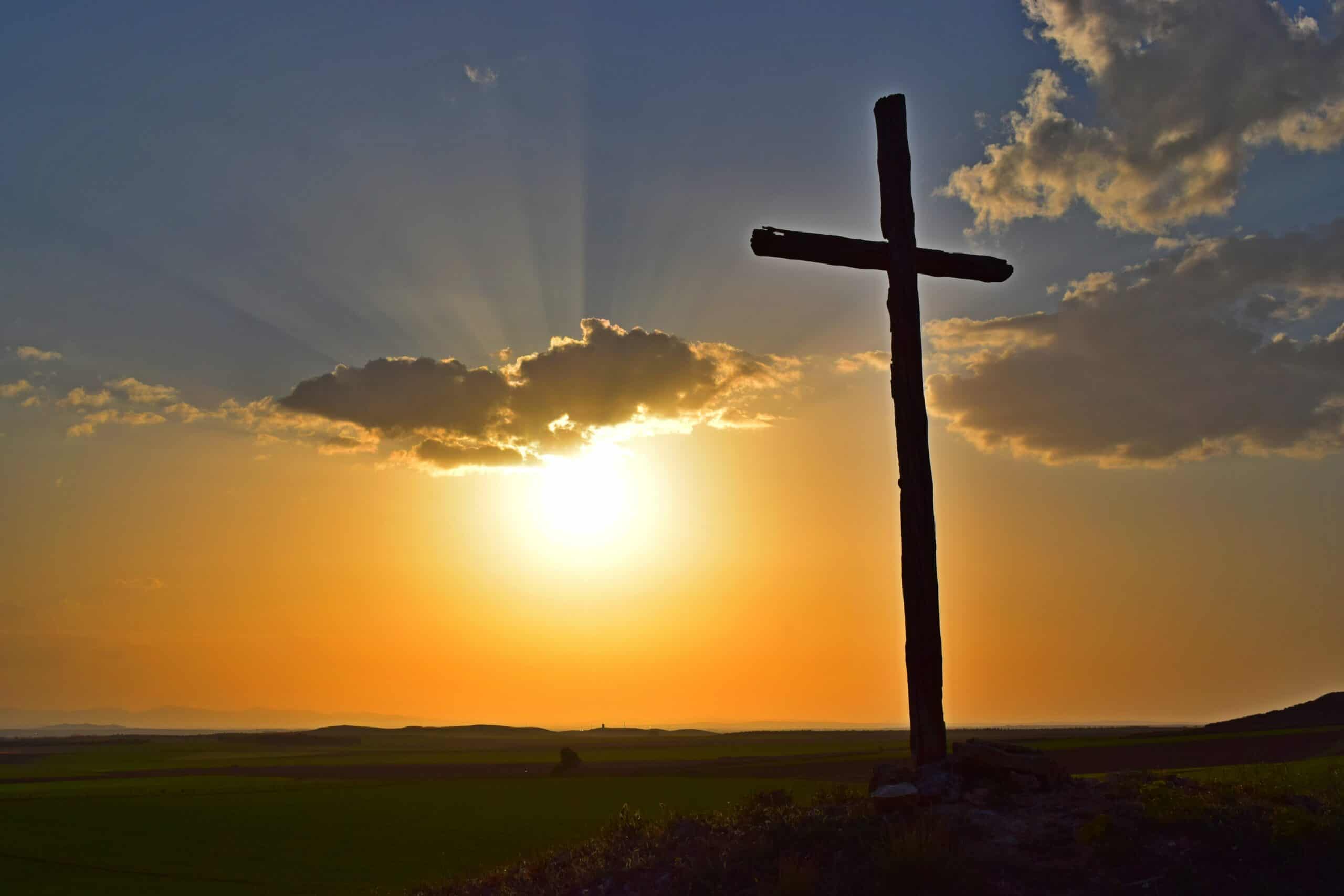 sunset with the silhouette of a cross