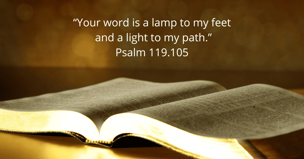 Opened Bible with the verse Psalm 119:105 written above it.