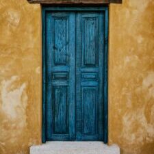A wooden, turquoise door.