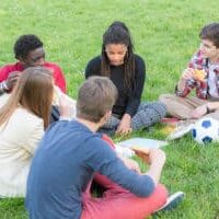 teens-taking-a-break-at-park-medium