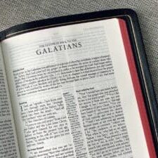 A Bible open to the book of Galatians.