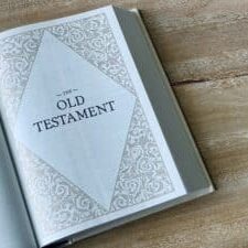 Bible opened to the Old Testament title page