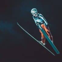 competitive snow skier in air